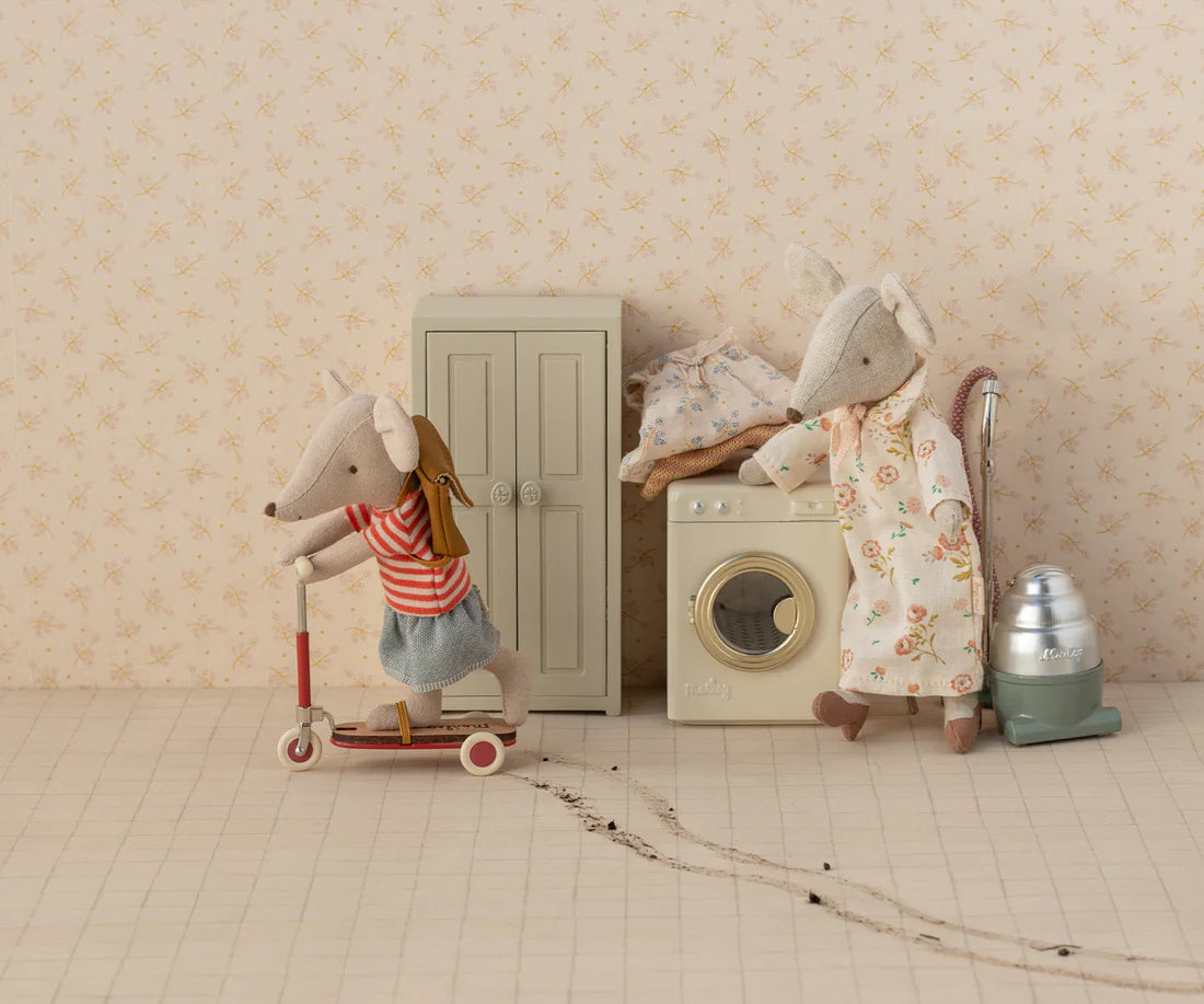 Stuffed mouse toy of a sister mouse on a scooter and a mum mouse with standing by in the laundry room -Sister Mouse - Big Sister