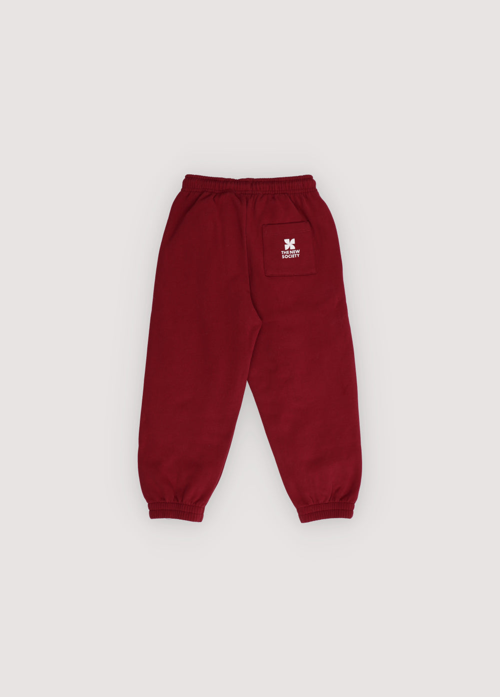 Maroon sweatpants with a logo on a light gray background